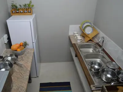a small kitchen with a sink and a counter at Waterbessiebos cottage in Tzaneen