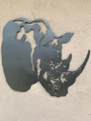 a metal object with a reflection in the water at Lindanda Luxury Lodge in Hoedspruit
