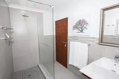 a bathroom with a shower and a sink at Kruger Park Lodge Unit No. 608A in Hazyview