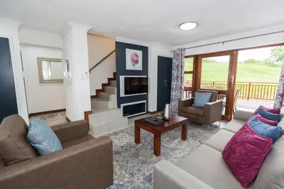 a living room with a couch and a table at Kruger Park Lodge Unit No. 608B in Hazyview