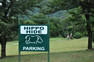a sign for a hippo hide parking in a park at Kruger Park Lodge Unit No. 610B in Hazyview