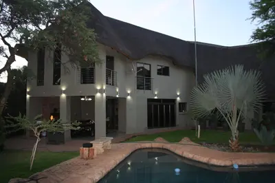 a house with a swimming pool in front of it at Oryx B&B Reserved Guests Only in Mokopane