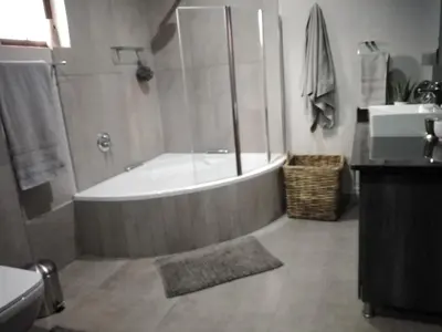 a bathroom with a bath tub and a sink at Oryx B&B Reserved Guests Only in Mokopane