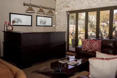 a living room with a couch and a table at Oryx B&B Reserved Guests Only in Mokopane