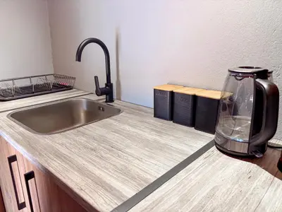 a kitchen counter with a sink and a toaster at @30 Zebra in Polokwane