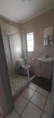 a bathroom with a toilet and a sink at 462 Bosbok Chalets in Marloth Park