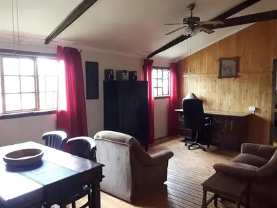 a living room with a table and chairs at Declan House in Louis Trichardt