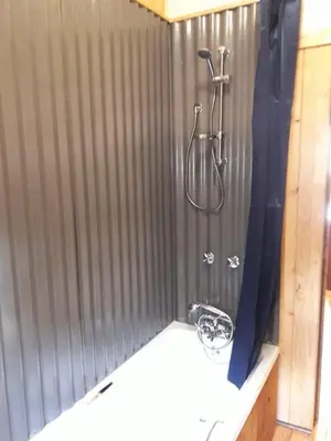 a bathroom with a shower with a shower curtain at Declan House in Louis Trichardt