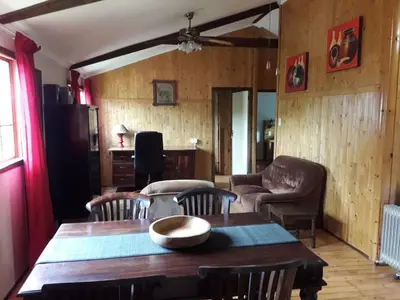 a living room with a wooden table and chairs at Declan House in Louis Trichardt