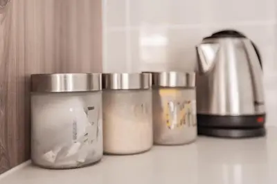 a group of five jars sitting on a counter at Alimama Spaces: The Manson's Blyde in Pretoria