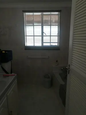 a bathroom with a tub and a toilet and a window at NJIRI - Your part of Africa in Marloth Park