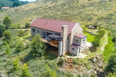 an aerial view of a house on a hill at 93 Hillcrest in Dullstroom