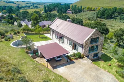 an overhead view of a house with a red roof at 93 Hillcrest in Dullstroom