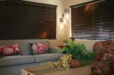 a living room with a couch and a table at Douglas Villas in Tzaneen