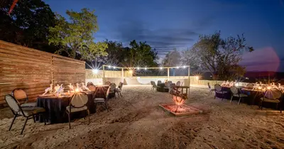 a wedding reception with tables and chairs in the dirt at Umbhaba Eco Lodge in Hazyview