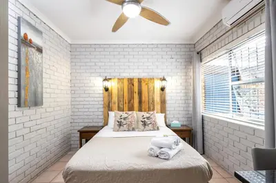 a bedroom with a bed with a stuffed animal on it at Rozelee Rest 1 in Nelspruit