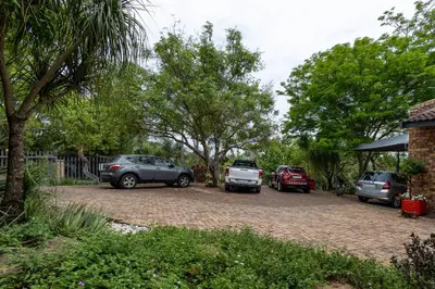 a group of cars parked in a driveway at Rozelee Rest in Nelspruit