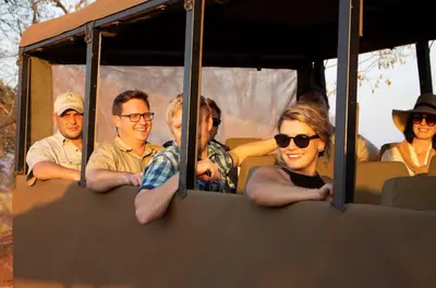 a group of people sitting in a bus at Kilima Private Game Reserve & Spa in Gravelotte