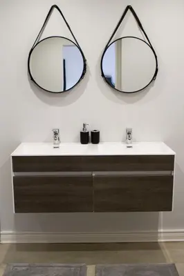 a bathroom with two mirrors above a sink at The Stables, Beaulieu Kyalami in Midrand