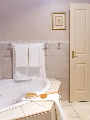 a bathroom with a bath tub with towels on it at Stans &co in Bethal