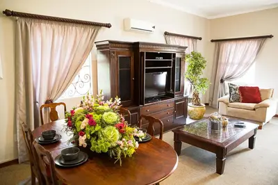 a living room with a table with flowers on it at Stans &co in Bethal