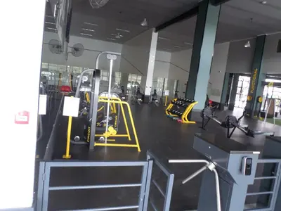a gym with yellow equipment in a room at The Blyde Crystal Lagoon Cologne3 in Greenview
