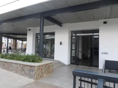 an office building with glass doors and a table at The Blyde Crystal Lagoon Cologne3 in Greenview