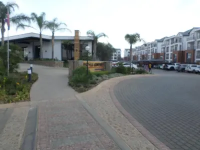 a cobblestone street in front of a building at The Blyde Crystal Lagoon Cologne3 in Greenview