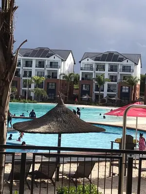 a group of people swimming in a swimming pool at The Blyde Crystal Lagoon Cologne3 in Greenview