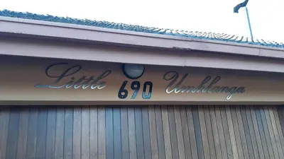a sign on the side of a building at Little Umhlanga. Sunflower suite. in Pretoria