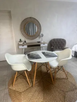 a living room with a table and two chairs at Annie’s Place Self Catering 2 in Kempton Park