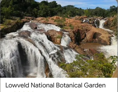 a view of a waterfall with the words luxury national botanical garden at Greenway Woods Chalet in White River