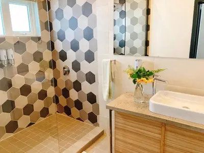 a bathroom with a sink and a shower at Mister C in Hartbeespoort