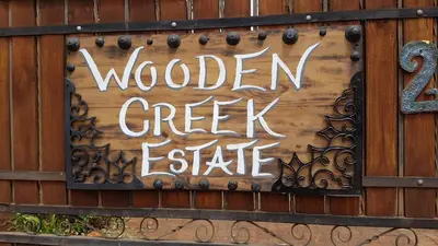a sign that reads wooden creek estate on a building at Wooden Creek Estate in Kempton Park