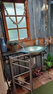 a bathroom with a sink and a window at Wooden Creek Estate in Kempton Park