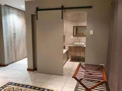 a bathroom with a shower and a sink at 42@ Ditholo Game Lodge in Thabazimbi