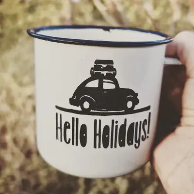 a person holding a cup with a car on it at Leopard's Lair Bush Lodge in Hoedspruit