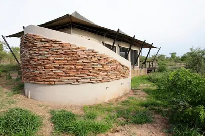 a building with a stack of bricks on it at Thabamati Luxury Tented Camp in Timbavati Game Reserve