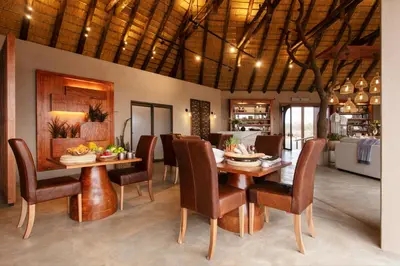 a dining room with a table and chairs at Thabamati Luxury Tented Camp in Timbavati Game Reserve