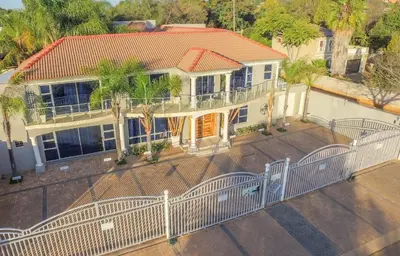 an aerial view of a house with a fence at Club Cocomo in Hartbeespoort