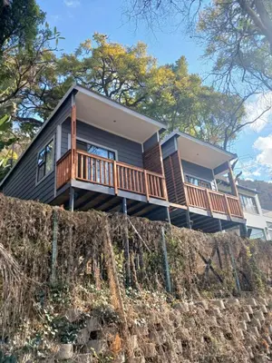a house on top of a retaining wall at Cozy Kosmos in Hartbeespoort