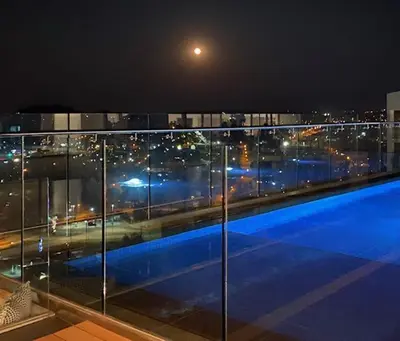 a view of a city at night from a building at MENLYN MAINE - One Bedroom Penthouse - NO LOAD SHEDDING!! in Pretoria