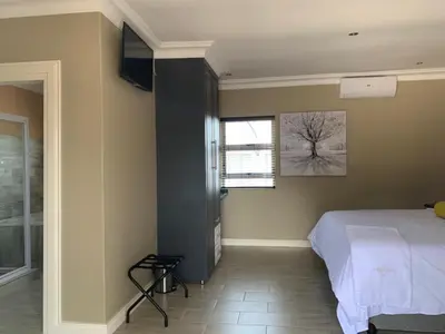 a bedroom with a bed and a window at La Fiato Luxury Lodge in Dalmada AH