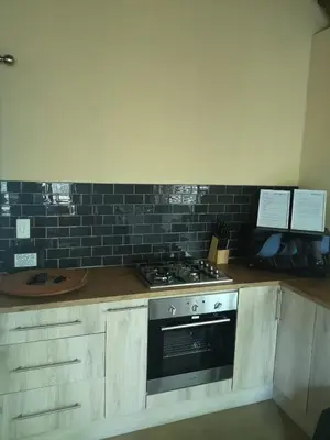 a kitchen with a stove and a counter top at Lion Hill @Kruger in Marloth Park