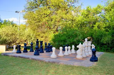 a giant chess set on a lawn at Suzie's Loft - NUDE - SunEden Family Naturist Resort in Pretoria
