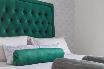 a bed with a green headboard and a green pillow at Alimama Spaces: The Manson's 8 On New in Midrand