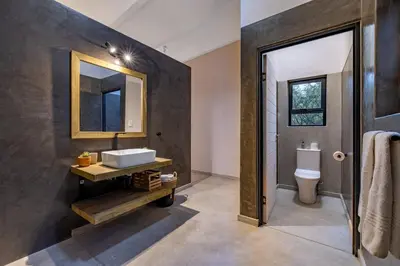 a bathroom with a sink and a toilet at 444 on Taaibos Bush Villa in Hoedspruit