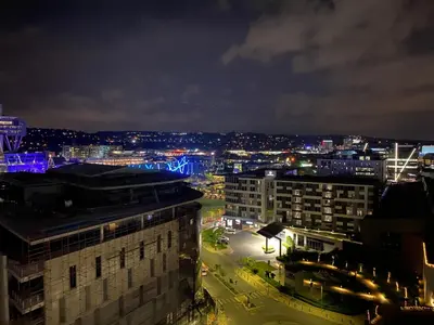 a view of a city at night with lights at Menlyn Maine Residence 11th Floor Apartment in Pretoria