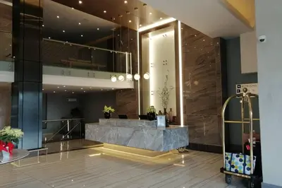 a lobby of a building with a reception desk at Regency Apartment Hotel Menlyn in Pretoria