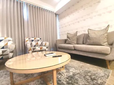 a living room with a coffee table and a couch at Regency Apartment Hotel Menlyn in Pretoria